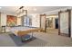 Stylish game room showcasing a modern pool table, unique lighting, and decorative sliding doors at 130 N Pearl St # 1804, Denver, CO 80203