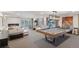 Elegant game room with pool table, comfortable lounge seating, and bright natural light at 130 N Pearl St # 1804, Denver, CO 80203