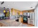 Modern kitchen with stainless steel appliances, granite countertops, and ample cabinet space at 130 N Pearl St # 1804, Denver, CO 80203