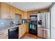 Well-equipped kitchen with modern appliances, granite counters, and updated cabinetry at 130 N Pearl St # 1804, Denver, CO 80203