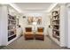 Cozy library with bookshelves, chairs, and an inviting ambiance at 130 N Pearl St # 1804, Denver, CO 80203
