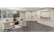 Well-lit lobby with herringbone floors, modern lighting, and comfortable seating at 130 N Pearl St # 1804, Denver, CO 80203