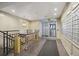 Well-lit hallway with a staircase and a row of mailboxes at 130 N Pearl St # 1804, Denver, CO 80203