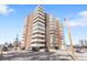 An impressive exterior view of a multi-story condo building with balconies and ample parking at 1888 S Jackson St # 604, Denver, CO 80210