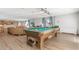 Recreational area with pool table, comfortable seating, and natural light at 1888 S Jackson St # 604, Denver, CO 80210