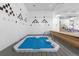 Enjoy a relaxing soak in the hot tub with deck and modern tile designs at 1888 S Jackson St # 604, Denver, CO 80210
