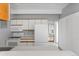 Well-lit kitchen with modern appliances, ample counter space, and a pass-through to another room at 1888 S Jackson St # 604, Denver, CO 80210