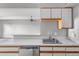 Modern kitchen featuring sleek appliances, ample counter space, and natural light at 1888 S Jackson St # 604, Denver, CO 80210