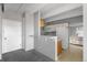 Open floor plan featuring a kitchen and entry hall area with neutral tones and ample natural light at 1888 S Jackson St # 604, Denver, CO 80210