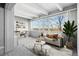 Sunlit living room with a desk, large window with a view, and modern decor at 1888 S Jackson St # 604, Denver, CO 80210