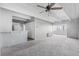 Open-concept living room with neutral tones, providing ample space for relaxation and entertainment at 1888 S Jackson St # 604, Denver, CO 80210