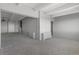 Open living area with carpet flooring and a fan, with light from the doorway at 1888 S Jackson St # 604, Denver, CO 80210