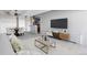 Cozy living room adjacent to dining area, with contemporary furnishings and plenty of natural light at 1888 S Jackson St # 604, Denver, CO 80210