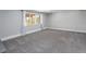 Spacious basement with new carpet, a large window, neutral decor, and ample natural light at 721 Forest View Rd, Monument, CO 80132