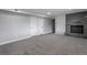 Finished basement with cozy fireplace, new carpet, and ample storage with two closet doors at 721 Forest View Rd, Monument, CO 80132