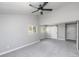 Spacious bedroom with vaulted ceiling, ceiling fan, modern barn door, and ample natural light at 721 Forest View Rd, Monument, CO 80132