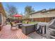 Inviting backyard featuring a spacious deck, comfortable seating, and a lush green lawn at 8801 W 65Th Ave, Arvada, CO 80004