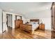 Bedroom featuring wood bed frame and hardwood floors at 8801 W 65Th Ave, Arvada, CO 80004