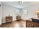Bedroom with hardwood floors, two windows and light gray walls at 8801 W 65Th Ave, Arvada, CO 80004