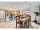 Bright kitchen and dining area with stainless steel appliances, modern countertops, and tile flooring at 8801 W 65Th Ave, Arvada, CO 80004