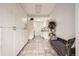 Practical laundry room with abundant storage, tiled floors, a utility sink and natural light at 8801 W 65Th Ave, Arvada, CO 80004