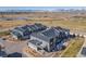 Aerial view of community featuring modern townhomes, open space, and mountain views at 821 Robert St, Longmont, CO 80503