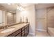 Double vanity bathroom with large mirror and tub at 821 Robert St, Longmont, CO 80503