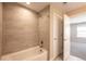 Clean bathroom with a bathtub and shower at 821 Robert St, Longmont, CO 80503