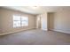 Spacious bedroom with large window and carpet at 821 Robert St, Longmont, CO 80503