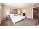 Spacious bedroom with plush carpet and en-suite bathroom access at 821 Robert St, Longmont, CO 80503