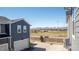 View of the home's exterior and surrounding landscape with mountain backdrop at 821 Robert St, Longmont, CO 80503