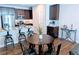 Modern kitchen with dark cabinetry, stainless steel appliances, and an island at 821 Robert St, Longmont, CO 80503