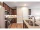 Modern kitchen with stainless steel appliances and a large island at 821 Robert St, Longmont, CO 80503