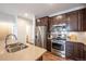 Modern kitchen with stainless steel appliances and double sink at 821 Robert St, Longmont, CO 80503