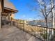 Balcony view of lake with iron railing and stone tile flooring, perfect for outdoor enjoyment at 1880 Mallard Dr, Broomfield, CO 80020