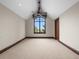Bedroom with a large window and neutral carpet at 1880 Mallard Dr, Broomfield, CO 80020