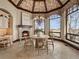 Charming breakfast nook with fireplace and scenic views from large windows at 1880 Mallard Dr, Broomfield, CO 80020