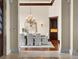 Elegant dining room featuring a chandelier, light-colored walls, and wood flooring, creating a welcoming atmosphere at 1880 Mallard Dr, Broomfield, CO 80020