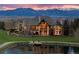 Stunning luxury home with mountain views, lakeside access, and impeccable landscaping at 1880 Mallard Dr, Broomfield, CO 80020