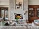 Living room with a stone fireplace, built-in cabinets, and a sliding glass door at 1880 Mallard Dr, Broomfield, CO 80020
