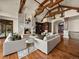 Cozy living room with fireplace, hardwood floors, and built-in shelving at 1880 Mallard Dr, Broomfield, CO 80020