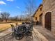 Outdoor dining area on a stone patio, perfect for entertaining and enjoying the property at 1880 Mallard Dr, Broomfield, CO 80020