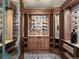 Climate-controlled wine cellar with custom racking and brick accent wall at 1880 Mallard Dr, Broomfield, CO 80020