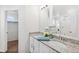 Stylish bathroom features double sinks, granite countertops, and a well-lit vanity area at 22063 E 38Th Pl, Aurora, CO 80019