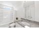 Clean bathroom featuring a tub shower, granite countertop, and bright natural light at 22063 E 38Th Pl, Aurora, CO 80019
