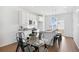 An open-concept kitchen and dining area showcases modern design with clean lines and sleek finishes at 22063 E 38Th Pl, Aurora, CO 80019