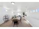 Spacious dining area with wooden table, black chairs, and ample natural light at 22063 E 38Th Pl, Aurora, CO 80019