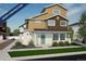 Modern two-story home with mixed siding, manicured lawn, and a welcoming light green front door at 22063 E 38Th Pl, Aurora, CO 80019