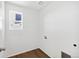 Functional laundry room with hookups and a bright window for natural light at 22063 E 38Th Pl, Aurora, CO 80019
