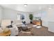 Cozy living room features a plush sofa, decorative accents, and soft carpet, creating a relaxing retreat at 22063 E 38Th Pl, Aurora, CO 80019